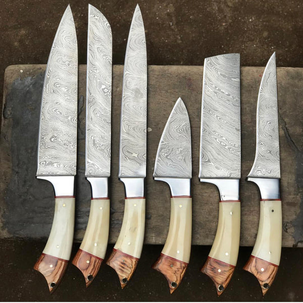 6-piece kitchen knives set with Twist Damascus steel blades, Exotic Wood and Bone handles, and steel bolsters, elegantly stored in a leather roll. A culinary masterpiece for discerning chefs.