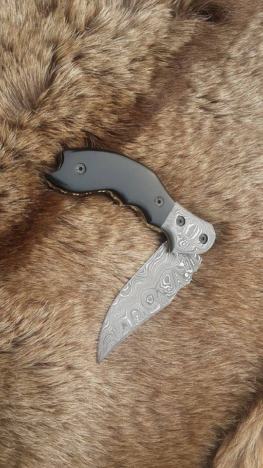 Intricate file work on the liner and spine of The Legacy Damascus Steel Folding Knife

