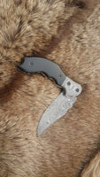 Intricate file work on the liner and spine of The Legacy Damascus Steel Folding Knife
