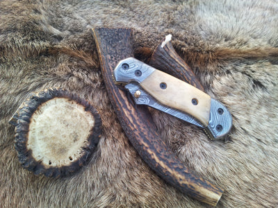 KBS Knives Store's The Titan Edge Folding Pocket Knife with leather sheath and Damascus steel blade