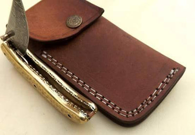 Liner lock mechanism on The Artisan Damascus Steel Folding Knife
