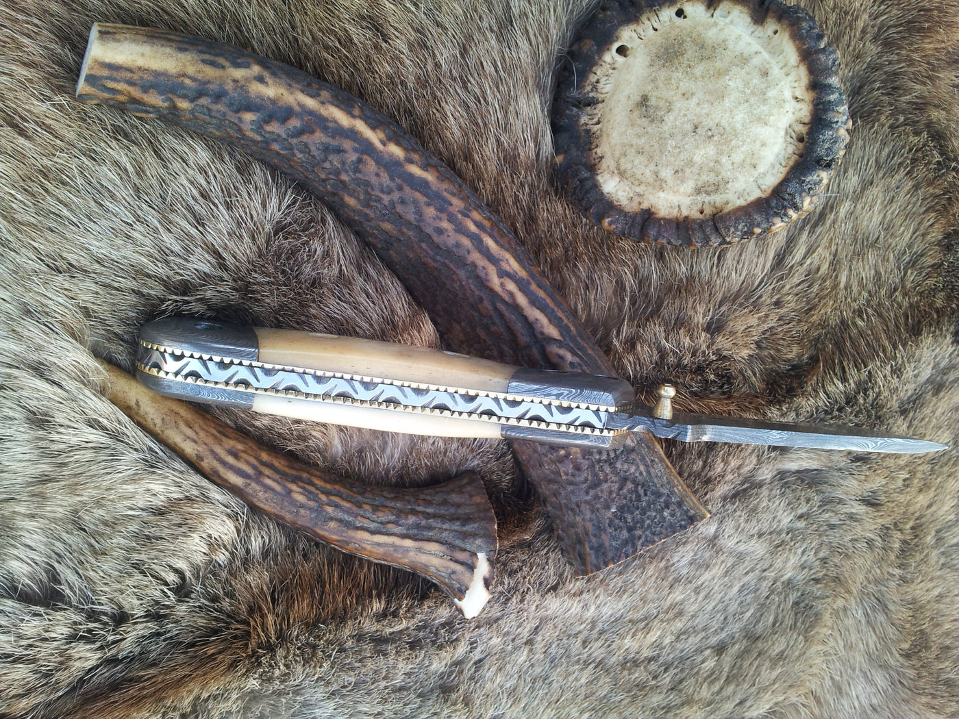 Liner lock mechanism on The Titan Edge Damascus Steel Tanto Blade Folding Pocket Knife
