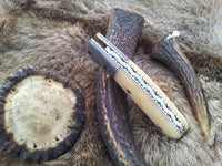 Liner lock mechanism on the BoneCraft Damascus Steel Folding Pocket Knife

