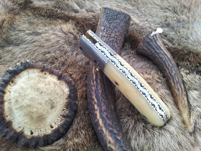 Liner lock mechanism on the BoneCraft Damascus Steel Folding Pocket Knife
