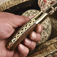 Micarta handle with brass bolster on the Titan Edge knife
