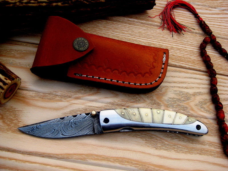 Premium leather sheath designed for the Everyday Carry Damascus steel pocket knife.
