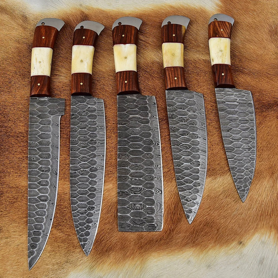 Full tang forged Damascus steel blades showcasing intricate designs