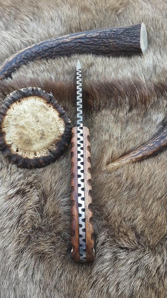 Great skinning knife displayed with a durable leather sheath, highlighting its outdoor readiness.