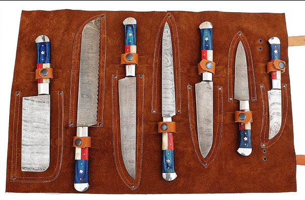 7-piece kitchen knives set with Twist Damascus steel blades, Texas Flag style handles, Exotic Wood and Bone with steel bolsters, elegantly stored in a leather roll. A culinary tribute to Texas heritage.