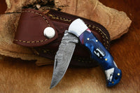 "Damascus Handmade Custom Folding Pocket Knife with Epoxy Resin and Steel Bolster Handle, 3-inch Blade Length, and Leather Case by KBS Knives Store"